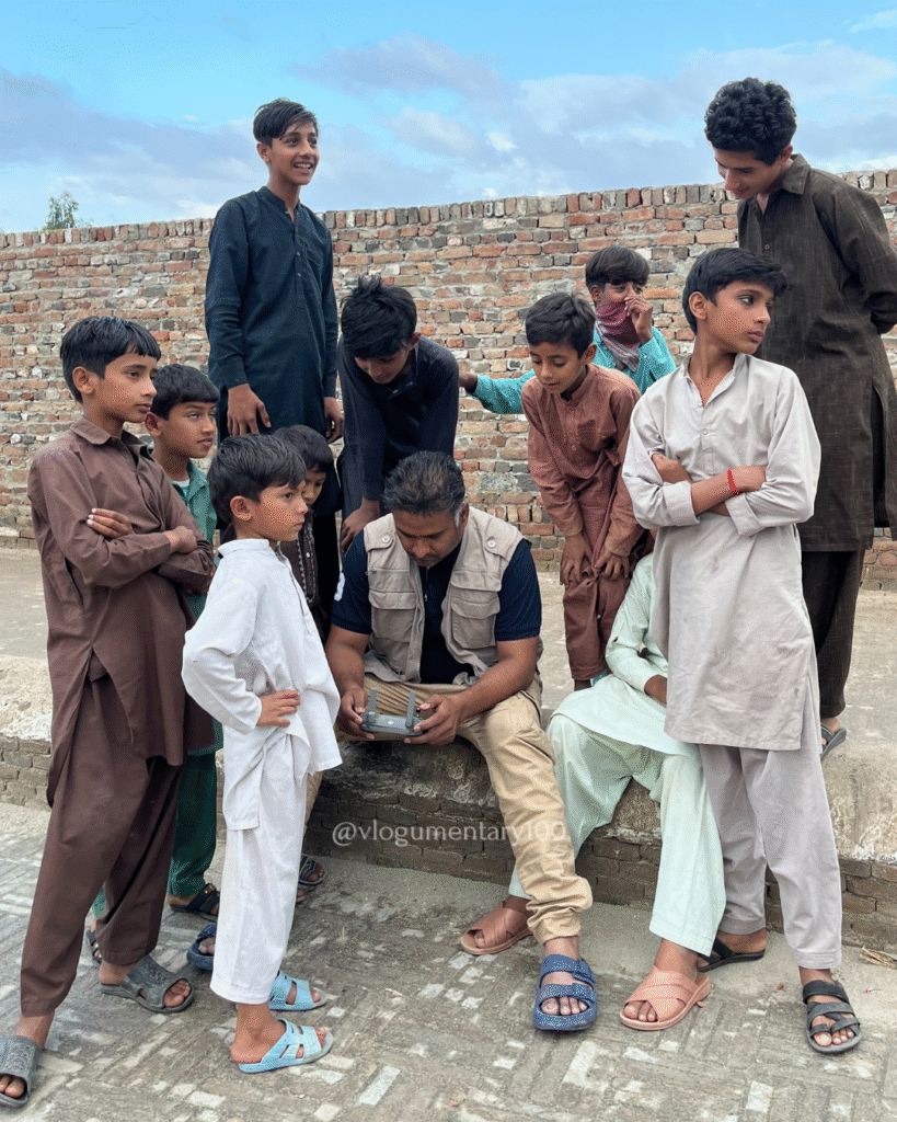 Dr. Muhammad Hameed using drone at Wan Bhachran Stepwell with children