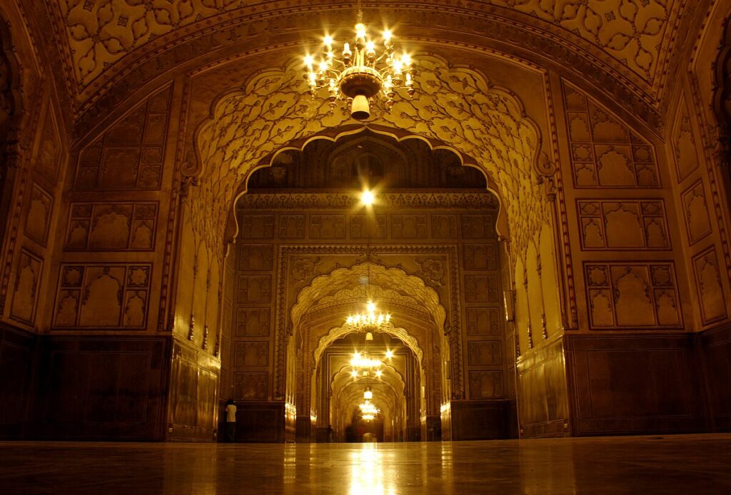 Badshahi Mosque night view with lights illuminating architecture