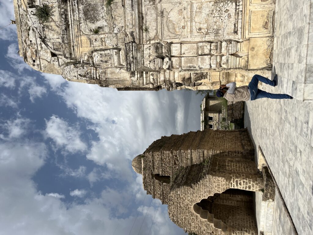 Dr. Hameed photographing the Nagara style temple of Katas Raj, capturing its distinctive silhouette