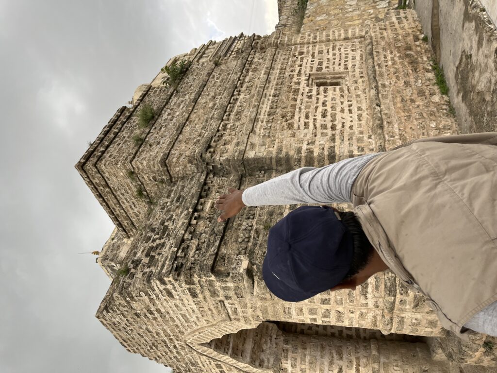 Dr. Mohammad Hameed guiding visitors through the history of an ancient Katas Raj temple