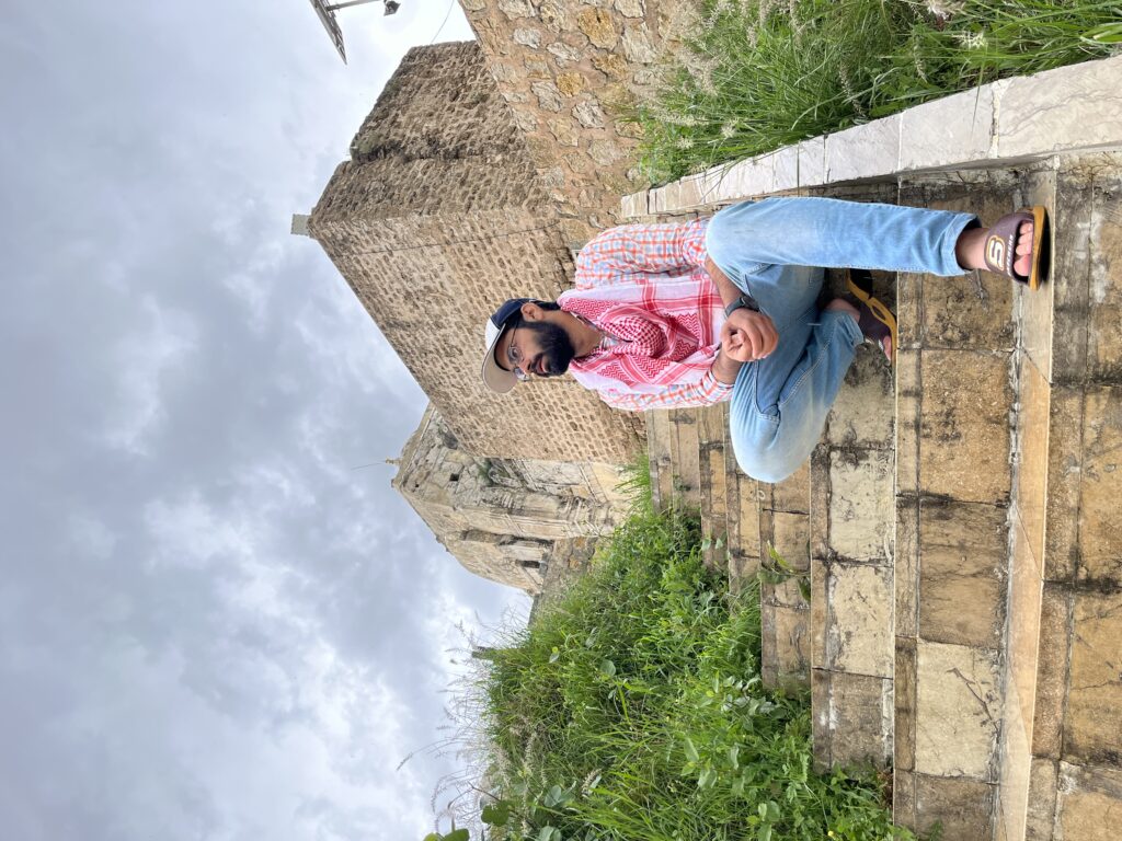 A contemplative moment while sitting on the stairs inside the Katas Raj temple complex