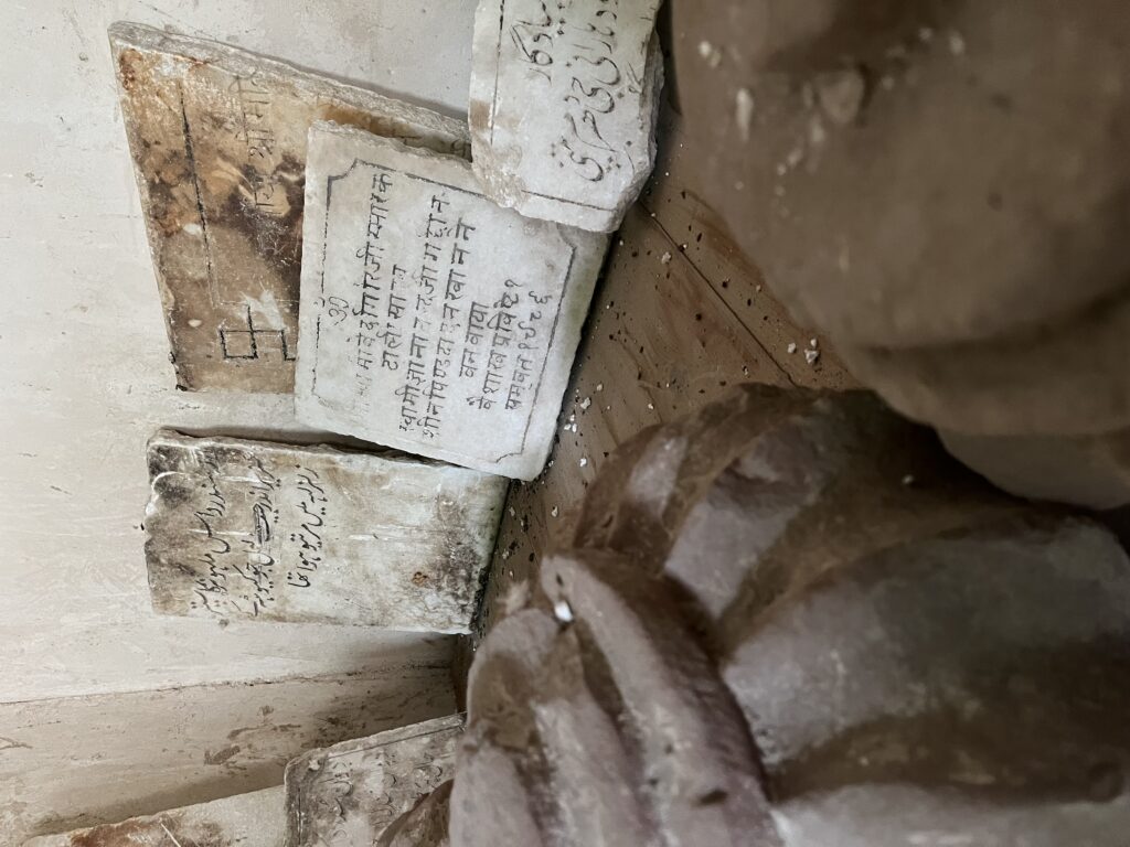Artifacts and old plaques displayed inside the haveli, narrating the heritage of Katas Raj