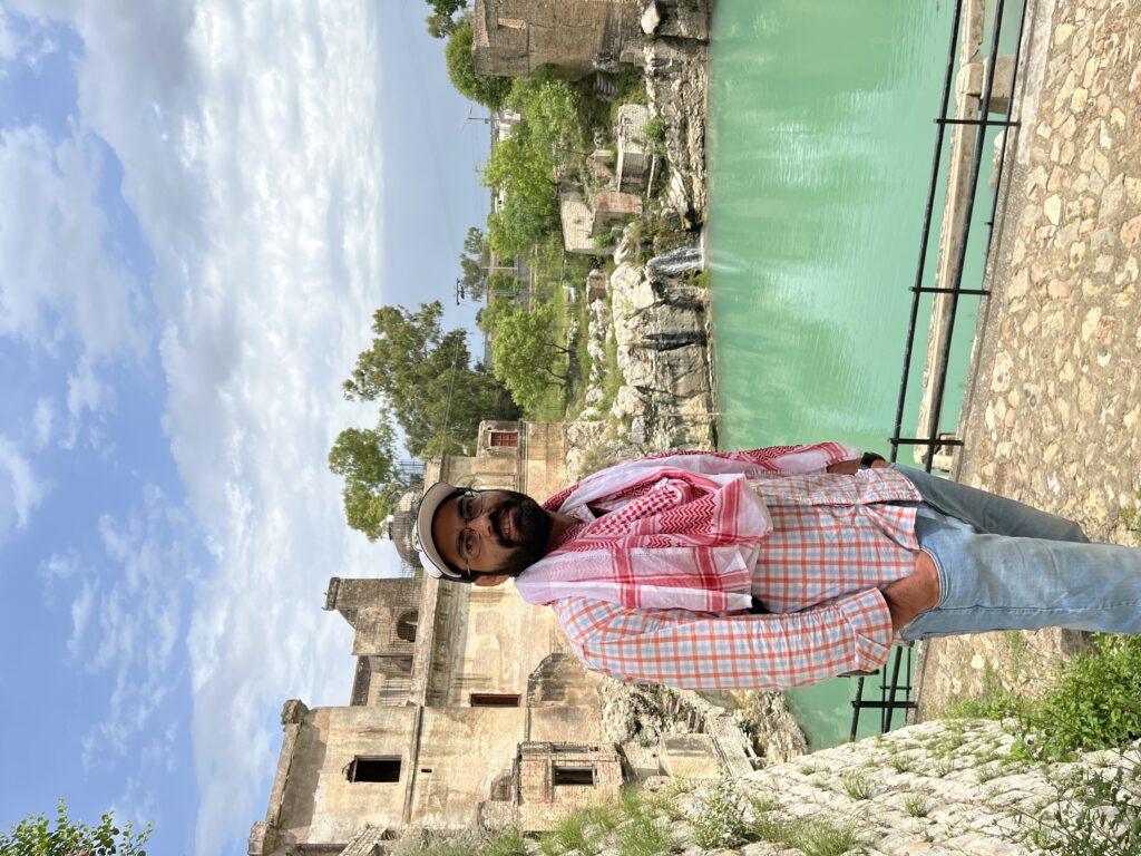 A scenic view in front of the temple buildings and the sacred pond at Katas Raj