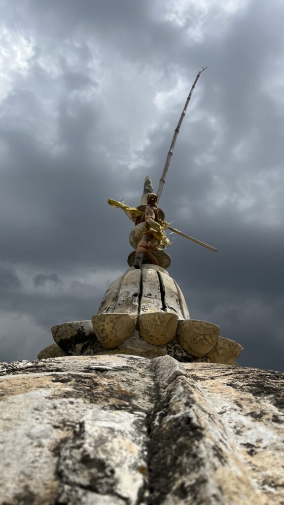 Devotees’ offerings tied to the kallis on the temple roof, symbolizing faith and spiritual devotion at Katas Raj