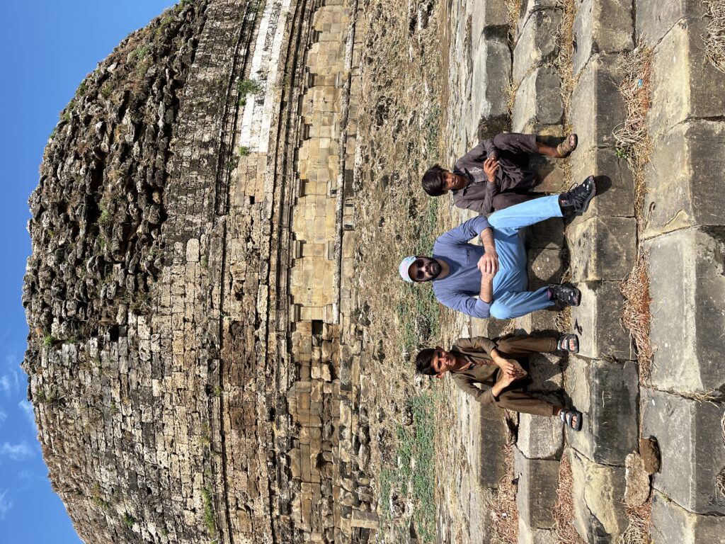 View of Mankiala Stupa dome, with local boys