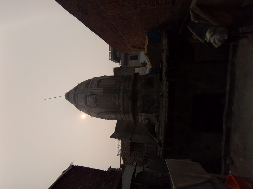 Old shikara of Radha Krishna Temple Lahore surrounded by houses